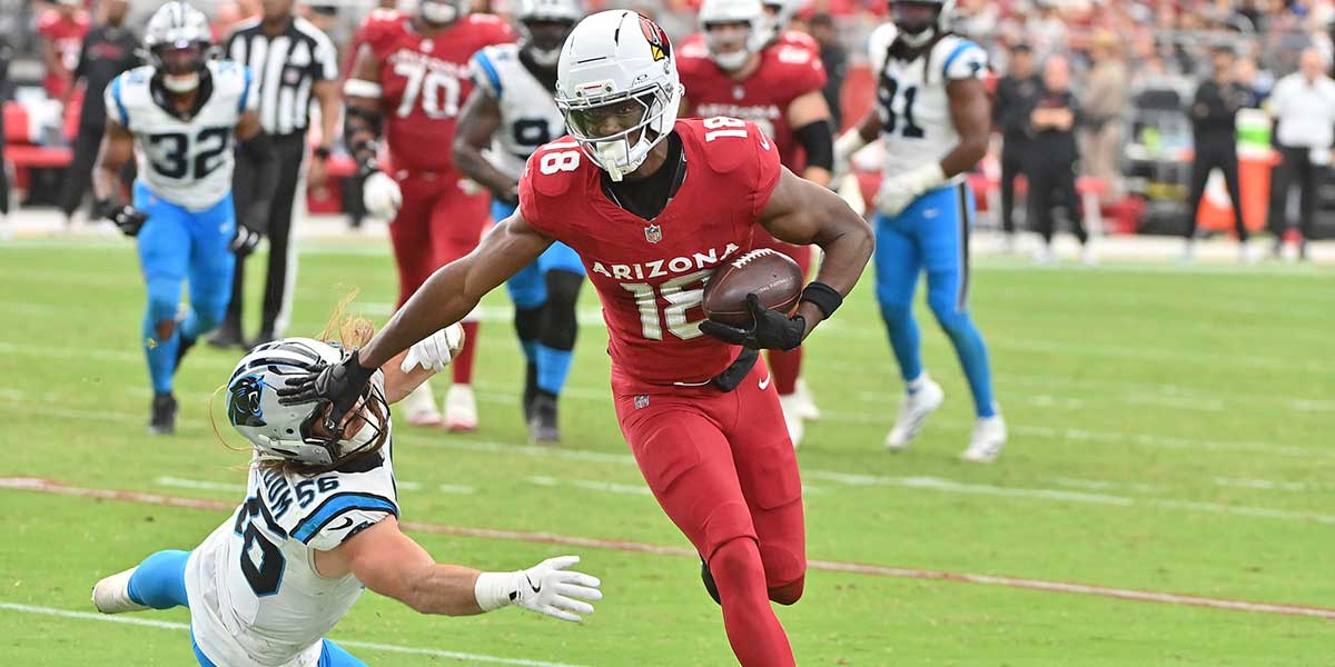Arizona Cardinals wide receiver Marvin Harrison Jr. (18) runs the ball defended by Carolina Panthers linebacker Christian Rozeboom (56) during the third quarter at State Farm Stadium