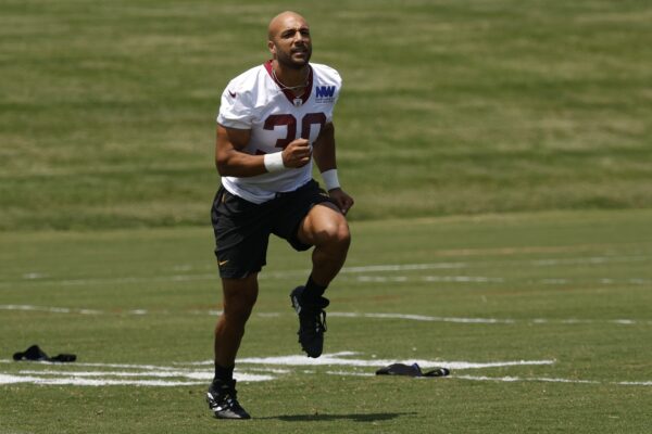 Washington Commanders running back Austin Ekeler (30) participates in a drill on day one of minicamp at Commanders Park.