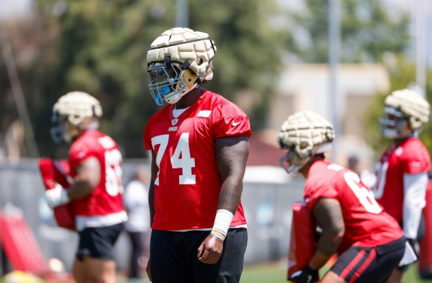 Spencer Burford (74) walks on the field during a practice session at the 49er's practice facility at Levi's Stadium in Santa Clara, Calif., on Tuesday, May 23, 2023. (Shae Hammond/Bay Area News Group)