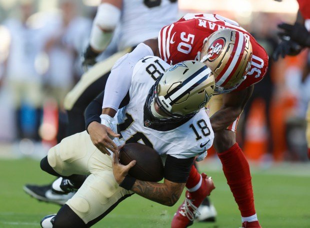 San Francisco 49ers' Jalen Graham (50) sacks New Orleans Saints' Spencer Rattler (18) in the fourth quarter of their preseason game at Levi's Stadium in Santa Clara, Calif., on Sunday, Aug. 18, 2024. (Nhat V. Meyer/Bay Area News Group)