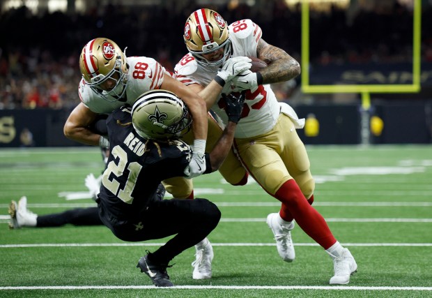 Luke Farrell #89 of the San Francisco 49ers scores a...
