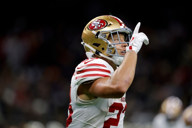 San Francisco 49ers running back Christian McCaffrey (23) celebrates after...