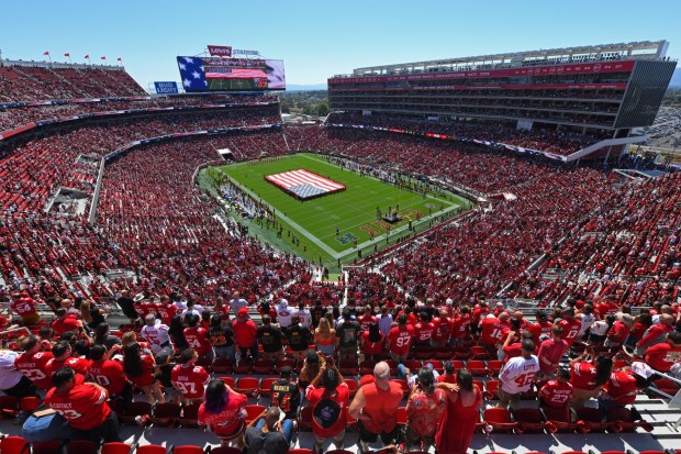 Football fans stand during the playing of the national anthem before their NFL game at Levi's Stadium in Santa Clara, Calif., on Sunday, Sept. 21, 2025. (Jose Carlos Fajardo/Bay Area News Group)