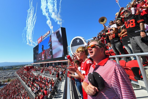 Football fans stand during the playing of the national anthem before their NFL game at Levi's Stadium in Santa Clara, Calif., on Sunday, Sept. 21, 2025. (Jose Carlos Fajardo/Bay Area News Group)