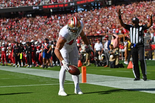 San Francisco 49ers' Kyle Juszczyk (44) spins the football in the end zone after scoring a touchdown in the fourth quarter of their NFL game at Levi's Stadium in Santa Clara, Calif., on Sunday, Sept. 21, 2025. San Francisco 49ers defeated the Arizona Cardinals 16-15. (Jose Carlos Fajardo/Bay Area News Group)