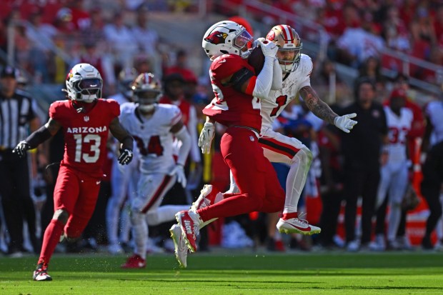 Arizona Cardinals' Dadrion Taylor-Demerson (42) intercepts a pass intended for San Francisco 49ers' Ricky Pearsall (1) in the fourth quarter of their NFL game at Levi's Stadium in Santa Clara, Calif., on Sunday, Sept. 21, 2025. San Francisco 49ers defeated the Arizona Cardinals 16-15. (Jose Carlos Fajardo/Bay Area News Group)