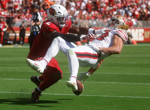 San Francisco 49ers' Christian McCaffrey (23) can't make a catch against Arizona Cardinals' Mack Wilson Sr. (2) on fourth down in the third quarter at Levi's Stadium in Santa Clara, Calif., on Sunday, Sept. 21, 2025. (Nhat V. Meyer/Bay Area News Group)