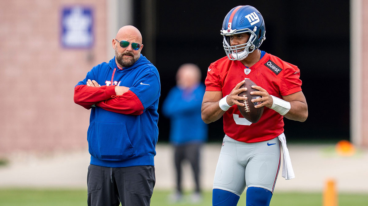 New York Giants coach Brian Daboll and Russell Wilson, who went viral for a throw to Jalin Hyatt during Giants OTAs.