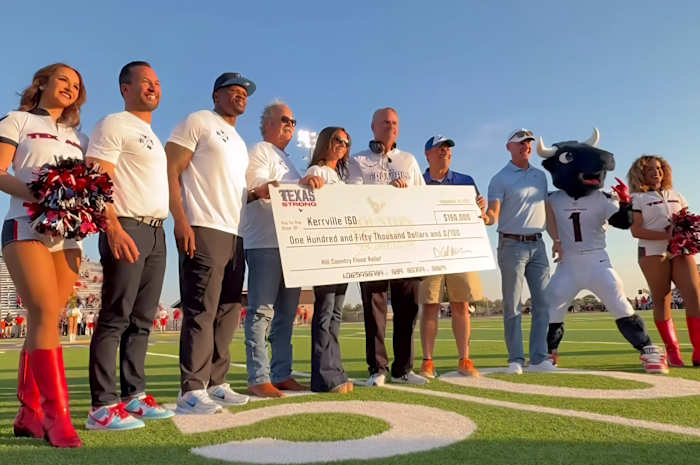 Texans’ Cal McNair, Hannah McNair, Andre Johnson, Mike Tomon visit Kerrville, give donations after flooding tragedy