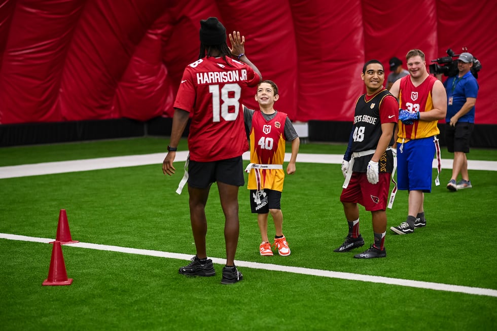 The Arizona Cardinals host athletes from Special Olympics for a youth football camp on...