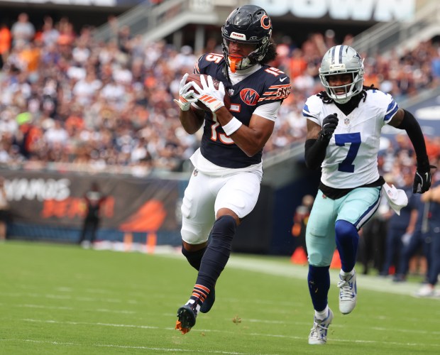 Bears wide receiver Rome Odunze catches a touchdown pass in...