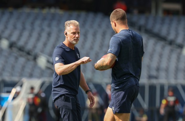 Former Bears coach and Dallas Cowboys defensive coordinator Matt Eberflus greets his players before the game Sept. 21, 2025, at Soldier Field. (Brian Cassella/Chicago Tribune)