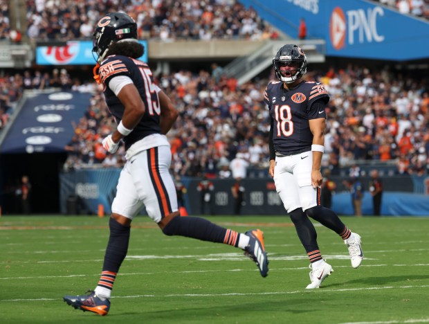 Chicago Bears quarterback Caleb Williams (18) celebrates his touchdown pass...