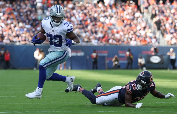 Dallas Cowboys running back Javonte Williams (33) runs the ball...