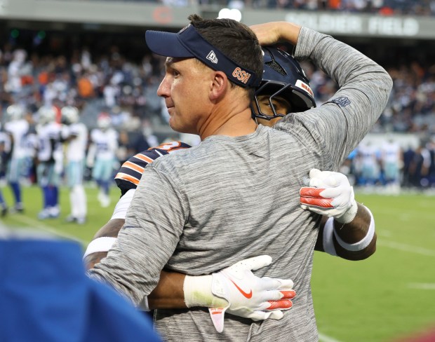 Chicago Bears defensive coordinator Dennis Allen celebrates the team’s third...