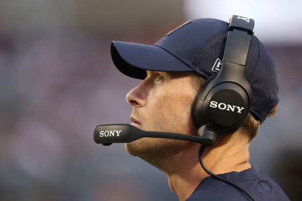 Chicago Bears head coach Ben Johnson watches the fourth quarter...