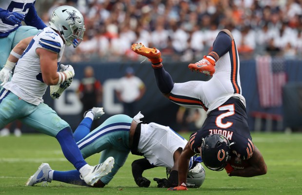 Chicago Bears wide receiver DJ Moore (2) tumbles after making...