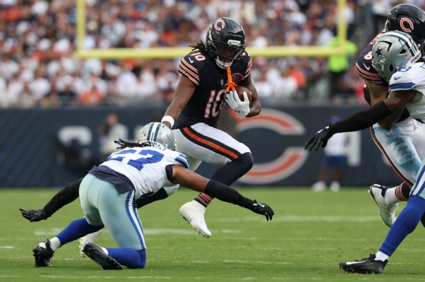 Chicago Bears wide receiver Luther Burden III (10) tries to...