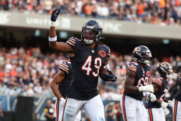 Chicago Bears middle linebacker Tremaine Edmunds (49) celebrates an interception...