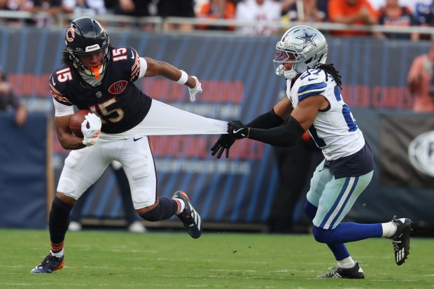 Chicago Bears wide receiver Rome Odunze (15) makes a reception...