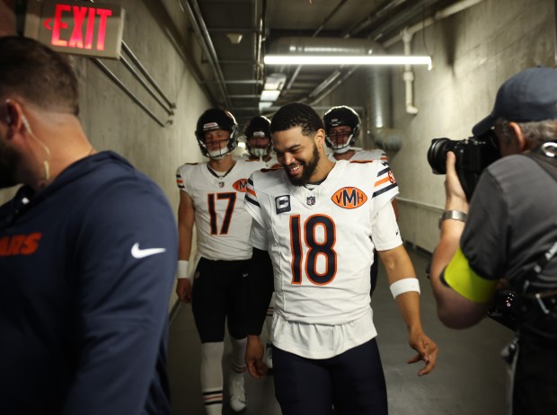 Bears quarterback Caleb Williams (18) and teammates head to the field for a game against the Lions at Ford Field on Sept. 14, 2025, in Detroit. (John J. Kim/Chicago Tribune)