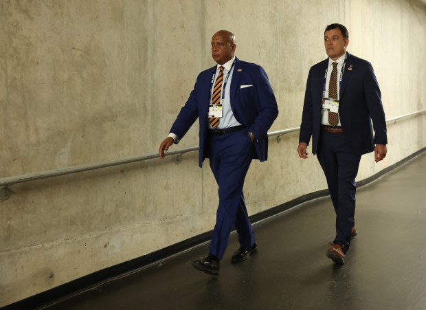 Bears President Kevin Warren, left, heads to the field for a game against the Lions at Ford Field on Sept. 14, 2025, in Detroit. (John J. Kim/Chicago Tribune)