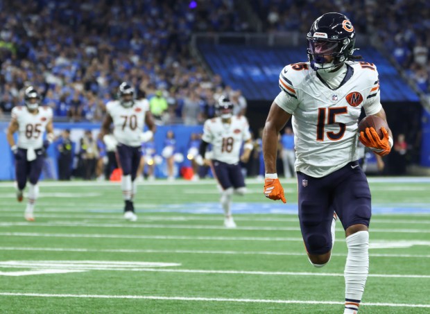 Bears wide receiver Rome Odunze runs into the end zone...