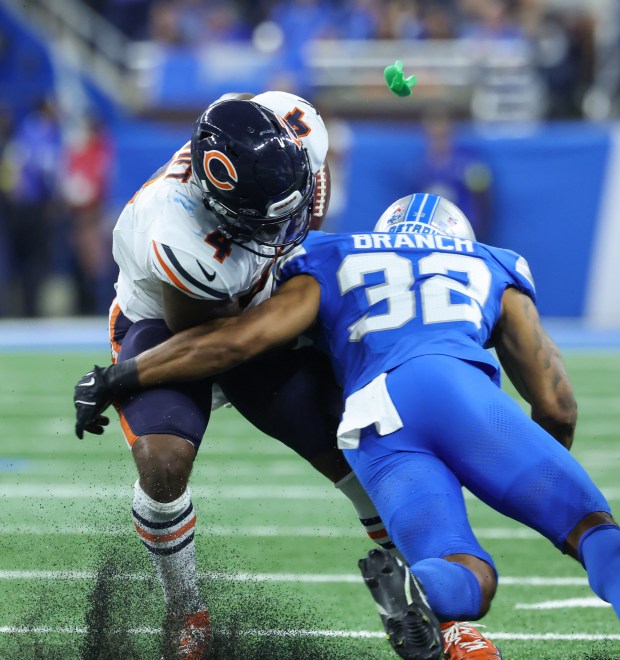 A mouthguard affixed to the helmet of Lions safety Brian...