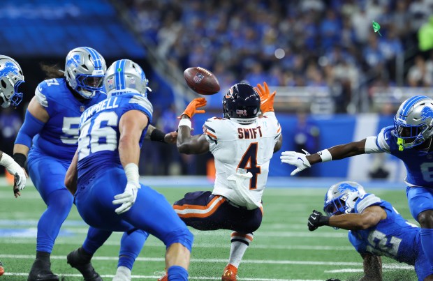 Bears running back D'Andre Swift fumbles the ball after getting...