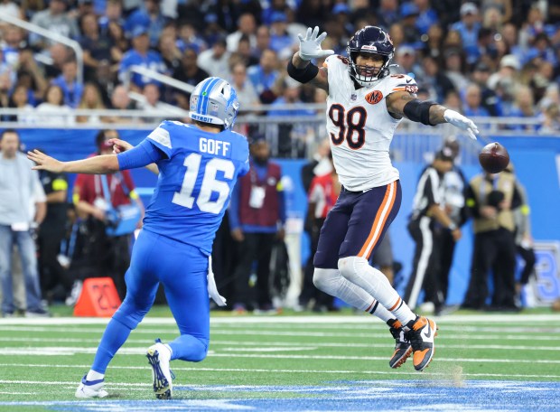 Lions quarterback Jared Goff throws a sidearm pass past Bears...