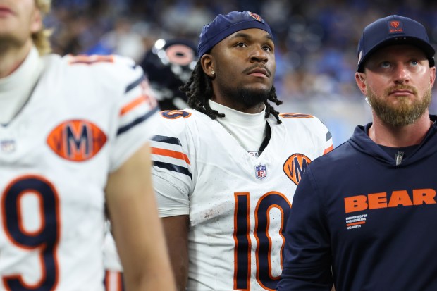 Bears wide receiver Luther Burden III watches the video board...