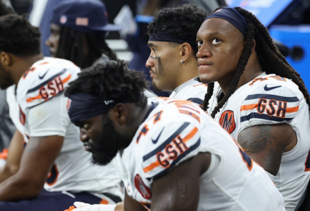 Bears linebacker Tremaine Edmunds, right, watches the video board in...