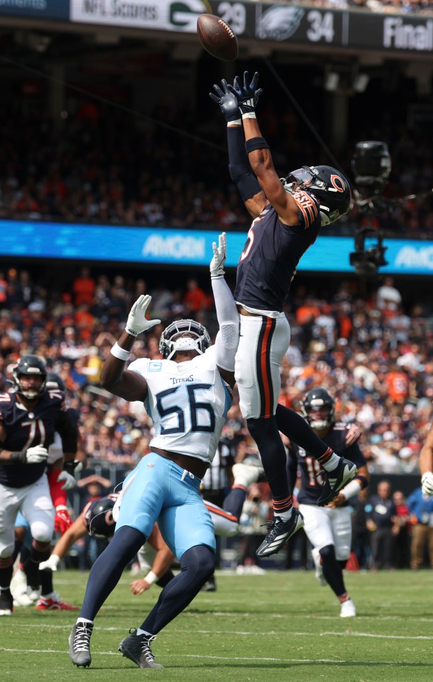 Chicago Bears wide receiver Rome Odunze, 15, grabs a batted...