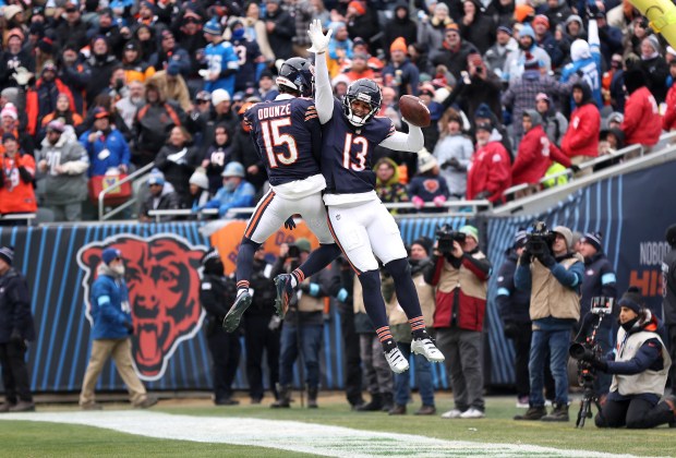 Chicago Bears wide receiver Keenan Allen (13) celebrates with teammate...