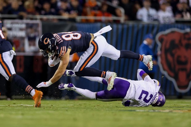 Minnesota Vikings cornerback Isaiah Rodgers (2) tackles Chicago Bears tight...