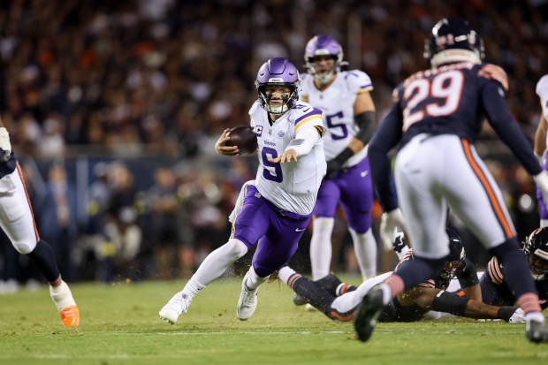 Minnesota Vikings quarterback J.J. McCarthy (9) runs the ball during...