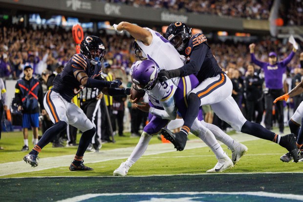 Minnesota Vikings quarterback J.J. McCarthy (9) scores a touchdown during...