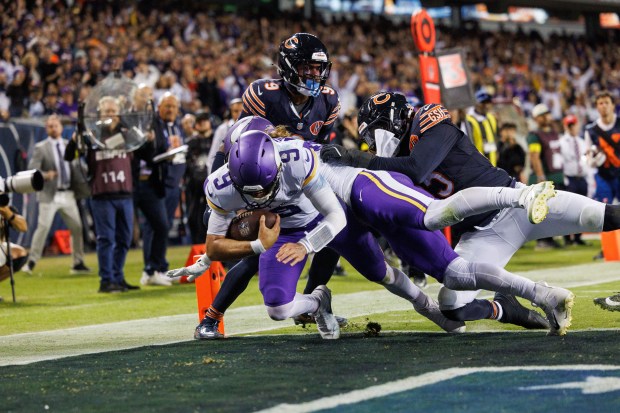 Minnesota Vikings quarterback J.J. McCarthy (9) scores a touchdown during...