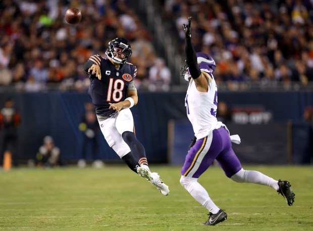 Bears quarterback Caleb Williams throws a pass for a first...