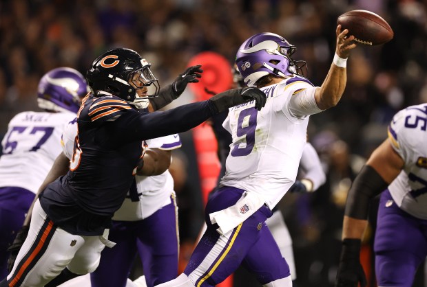 Chicago Bears defensive end Dayo Odeyingbo (55) disrupts the throw...