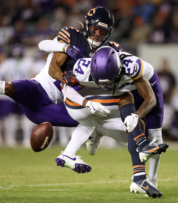 Minnesota Vikings cornerback Isaiah Rodgers and safety Jay Ward (24)...
