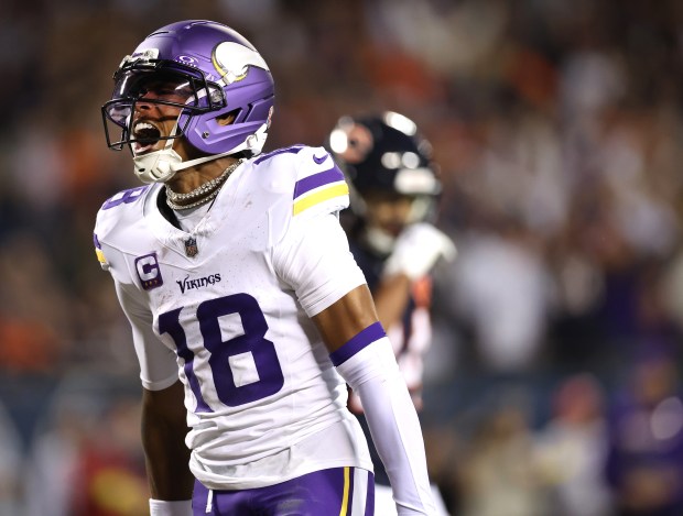 Minnesota Vikings wide receiver Justin Jefferson (18) celebrates after a...
