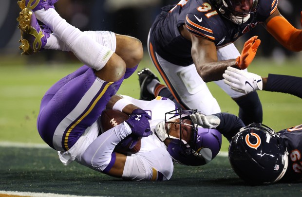 Minnesota Vikings wide receiver Justin Jefferson (18) scores a touchdown...