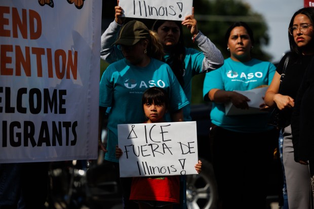 Activists attend a press conference at the scene where an...