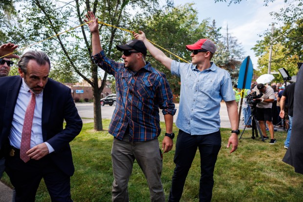 Members of the Federal Bureau of Investigation work the scene...