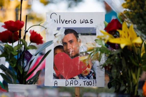 Flowers are displayed near a memorial, Sept. 15, 2025, for...
