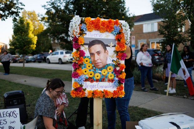 People install a memorial, Sept. 15, 2025, for Silverio Villegas...