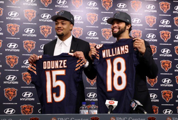 Bears wide receiver Rome Odunze and quarterback Caleb Williams pose...