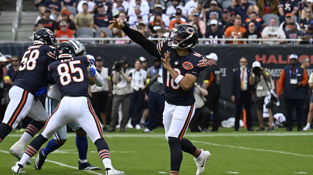Chicago Bears quarterback Caleb Williams (18) drops back to pass against the Dallas Cowboys during the first half at Soldier Field.