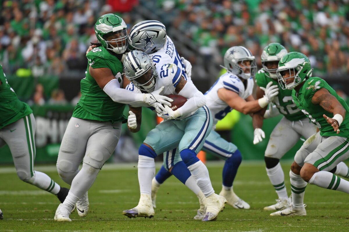 Philadelphia Eagles defensive tackle Jalen Carter (98) triers to stop Dallas Cowboys running back Rico Dowdle (23) during the third quarter at Lincoln Financial Field.